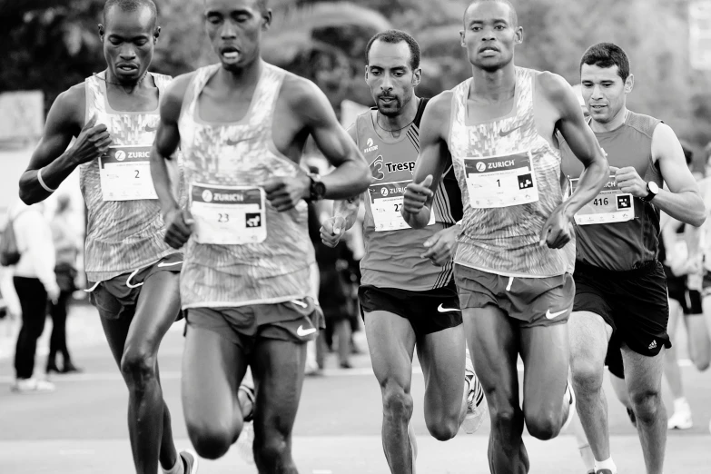 a group of men who are running on a track