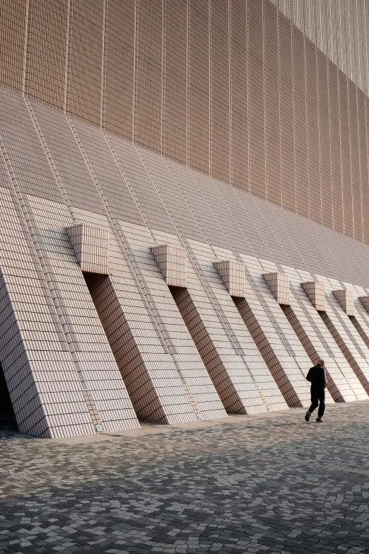 an abstract po of a person walking in front of a building