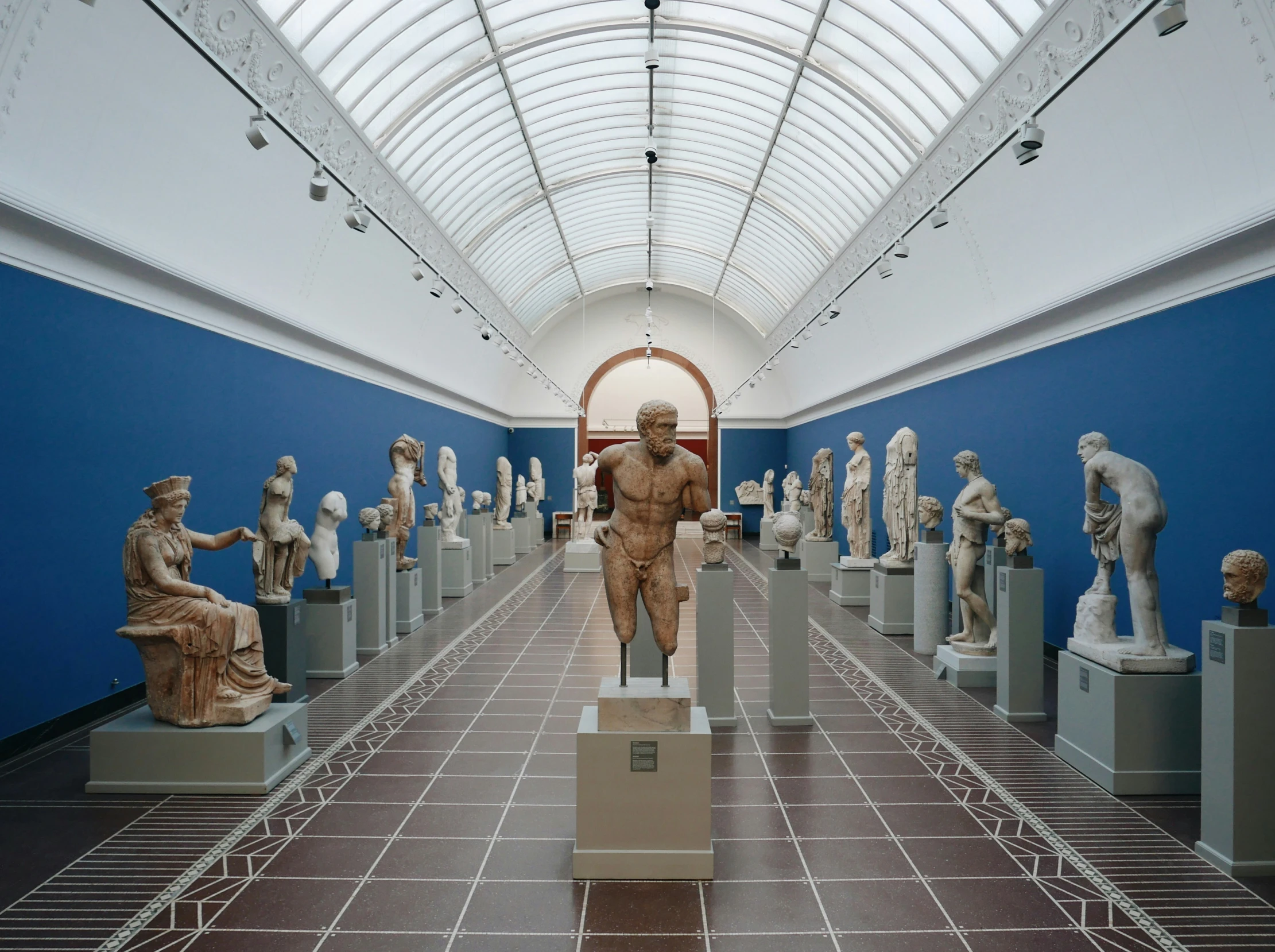 there is a large room with a lot of statues