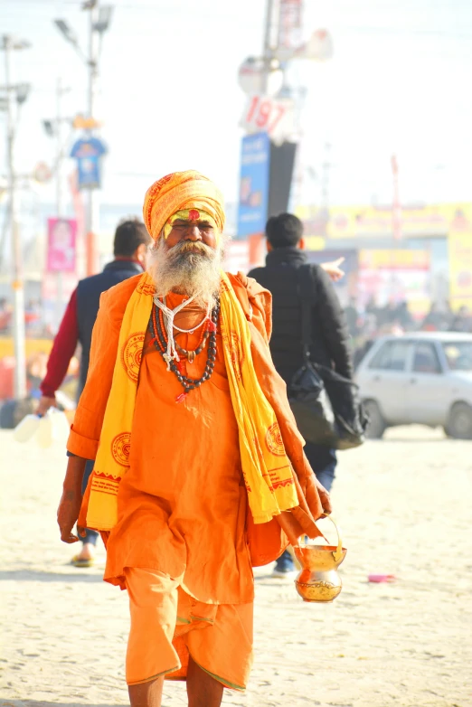 a man walking down the street with orange clothing