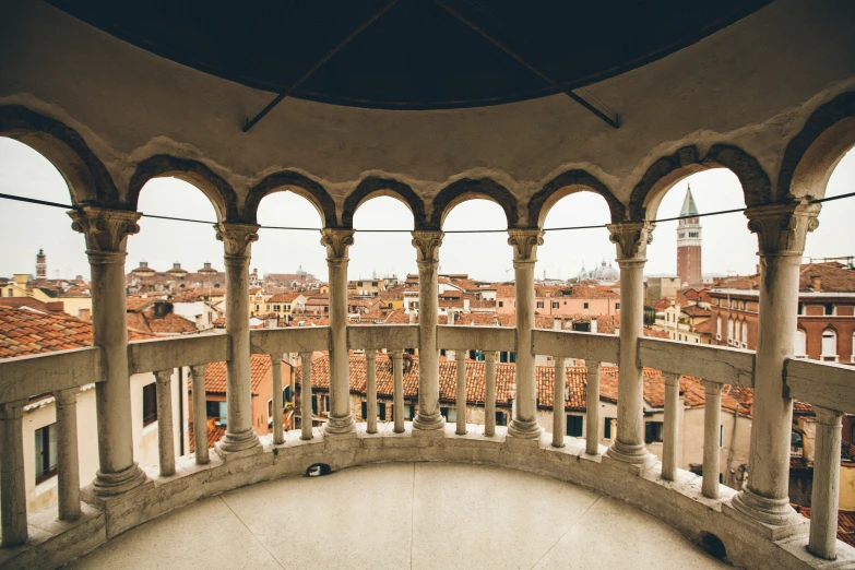 an old building with columns and arches in the center