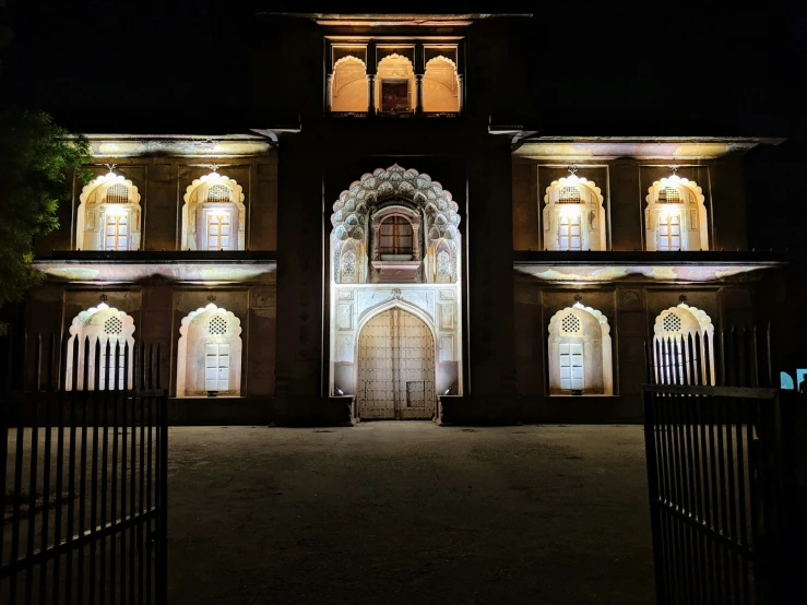 the night time pograph of a building lit up with lights