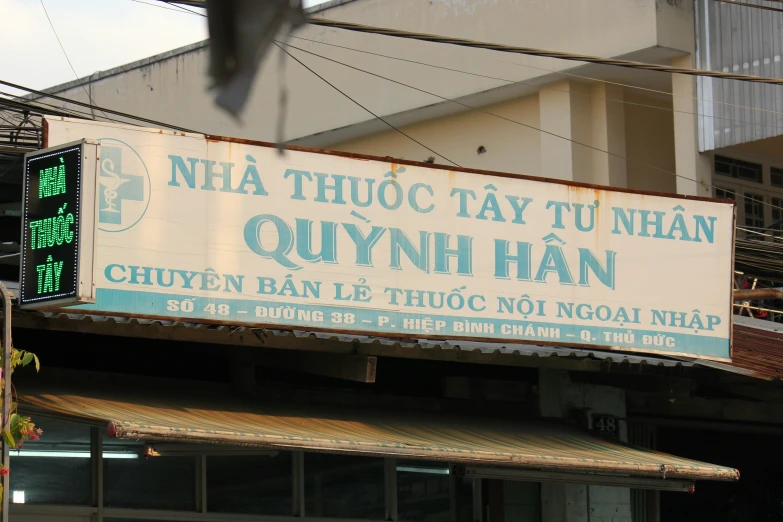sign on front of business in asian country