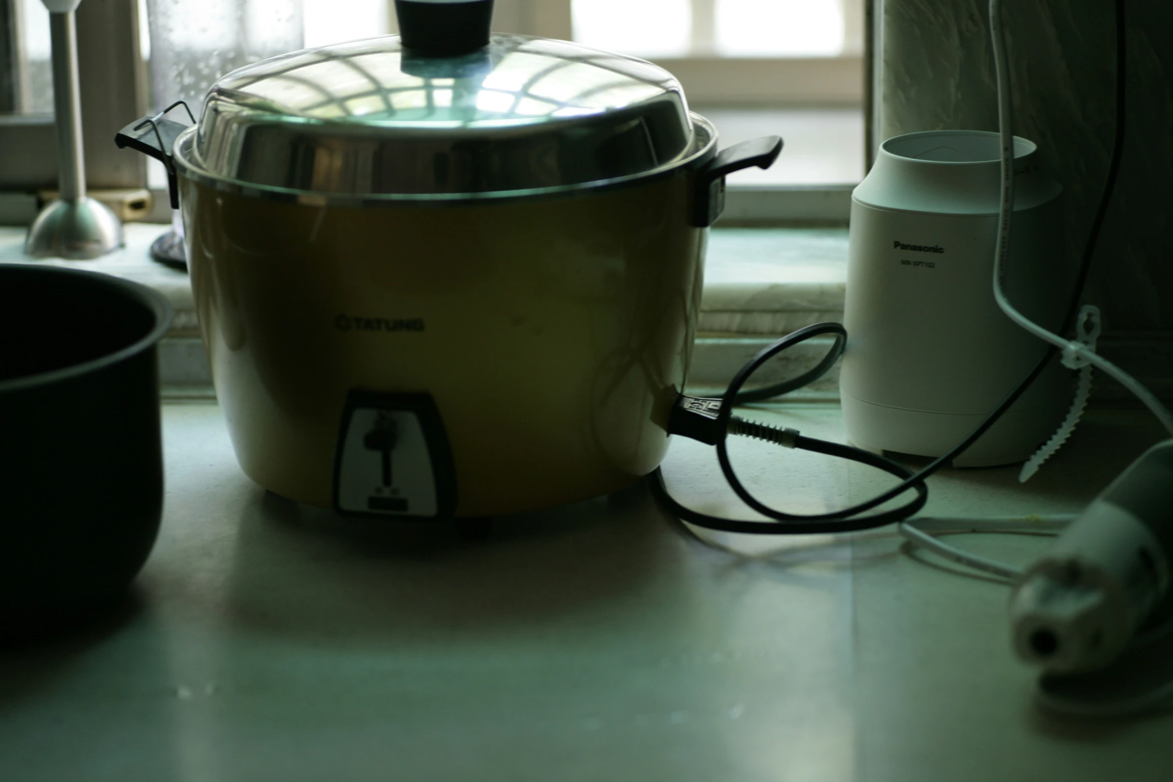 a blender is sitting on a countertop next to other appliances