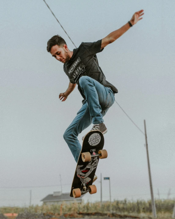 the skateboarder jumps high into the air to do tricks