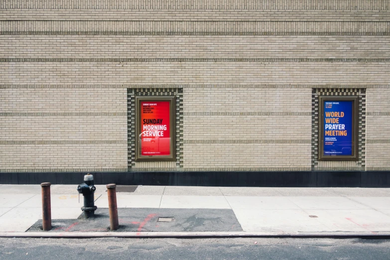 the building has two red and blue signs in between them