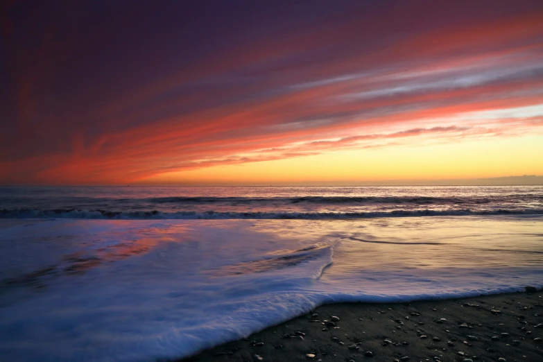 the sunsets is starting to light up the beach