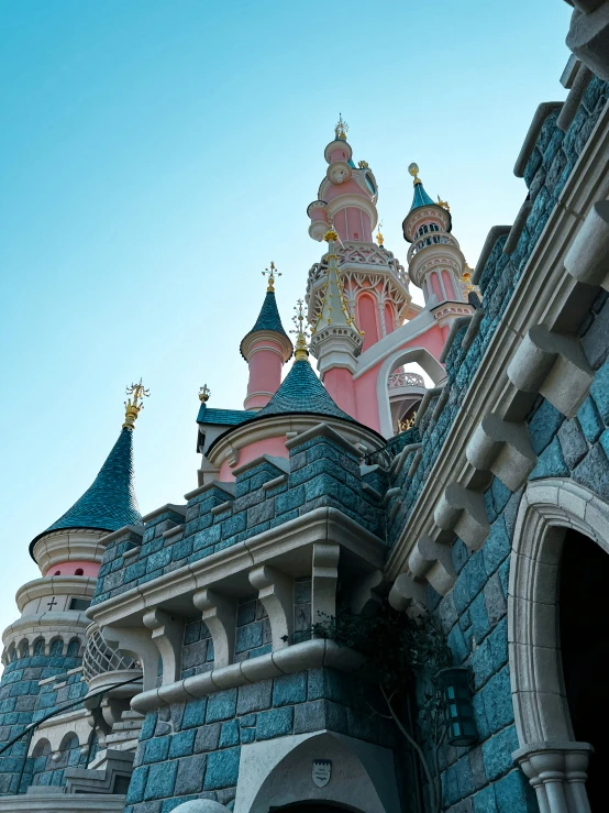 the top of a castle building has ornate decorations on it