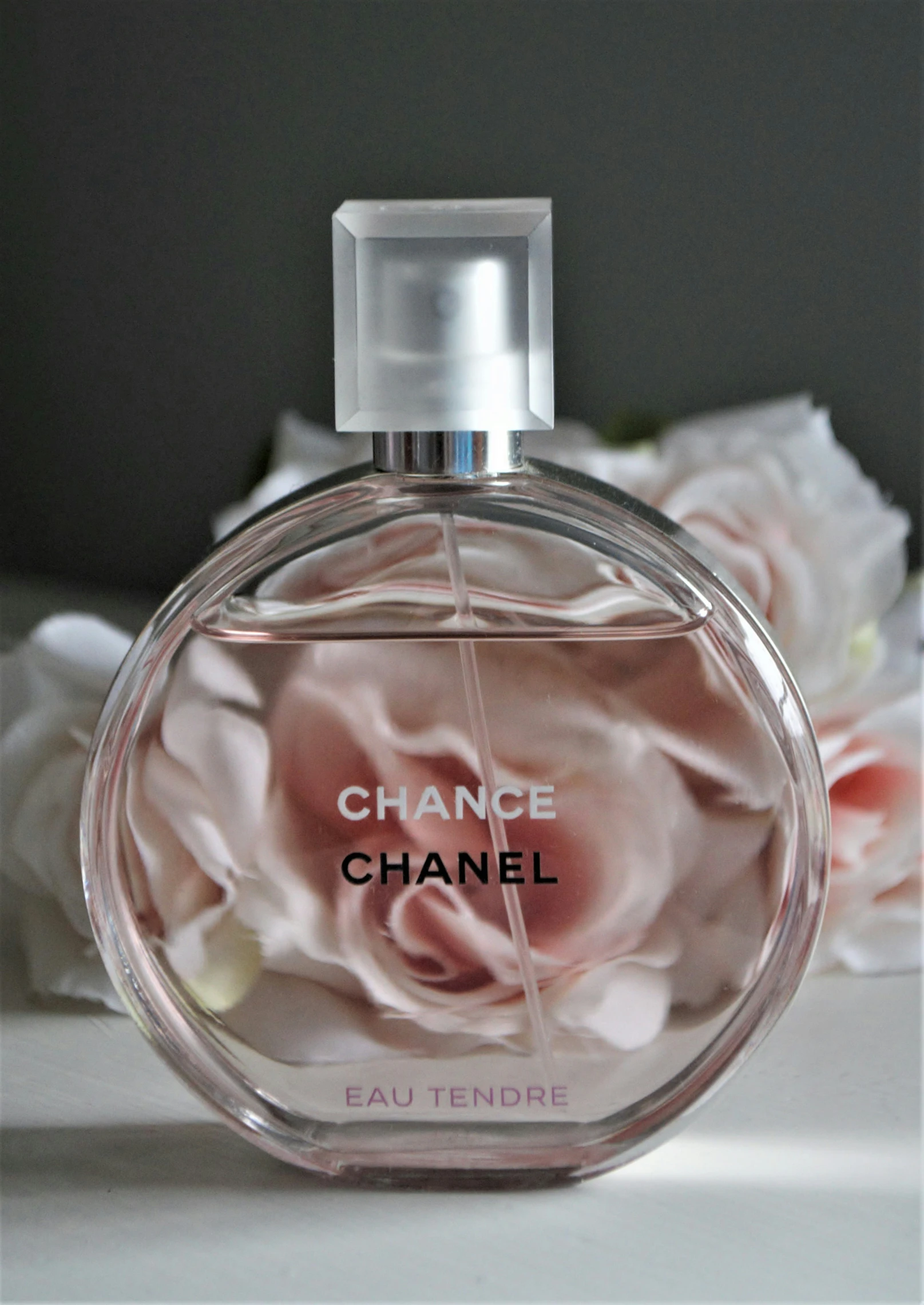 a bottle of chanel flower on a table