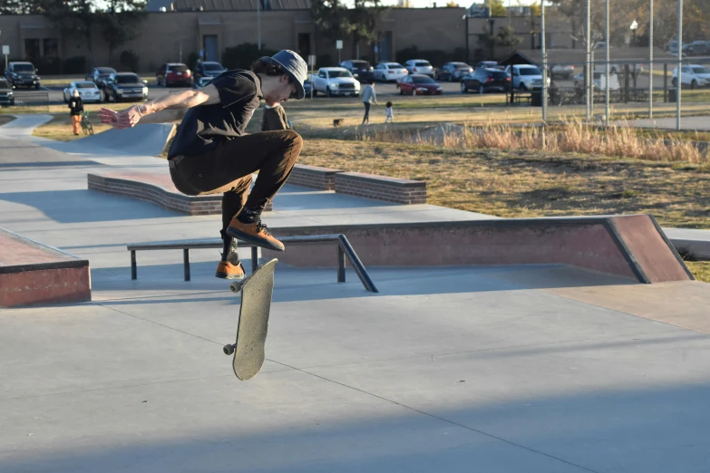 a skateboarder performing tricks on the edge of a bench