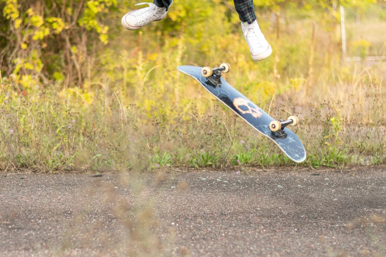 a person performing tricks on a skateboard in the air