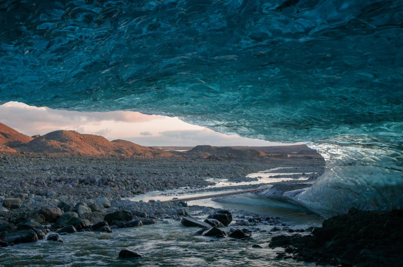 a cave entrance that is part of a desert