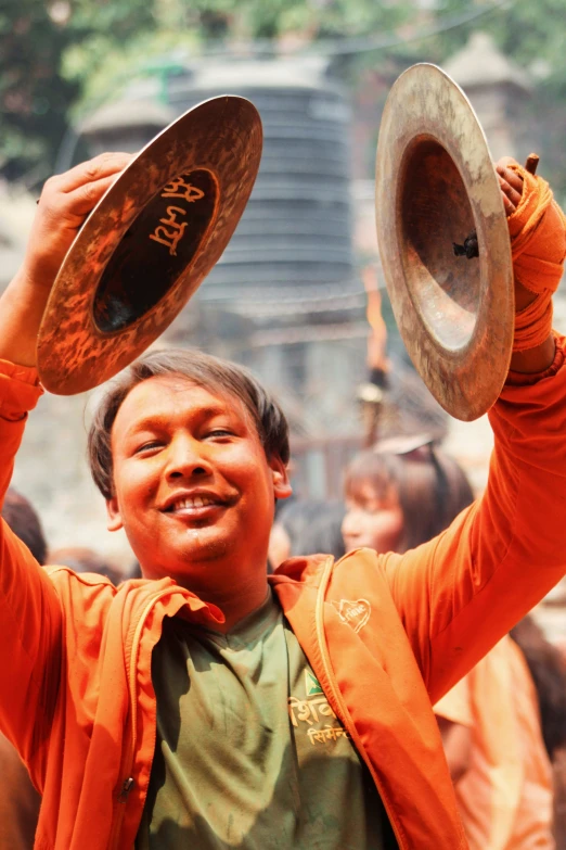 a man holding some small items with his hands