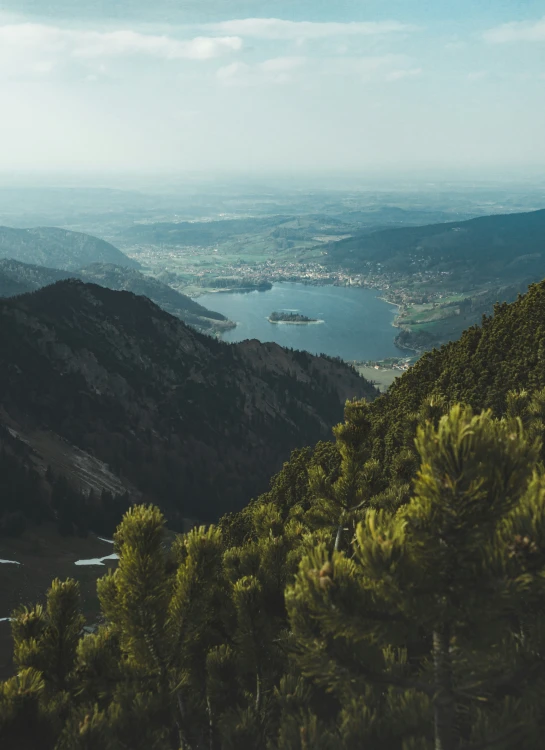 a view from the top of a hill to an lake