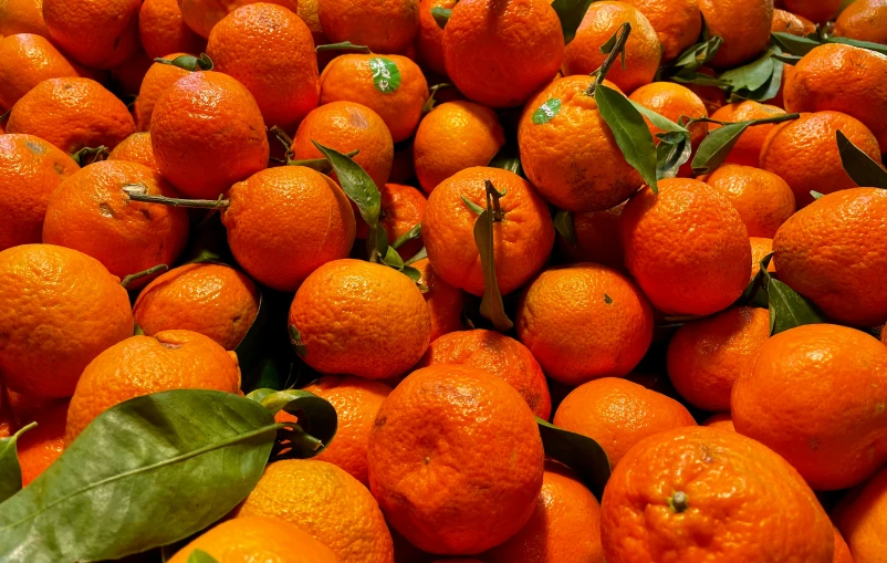 this is a big display of fresh oranges