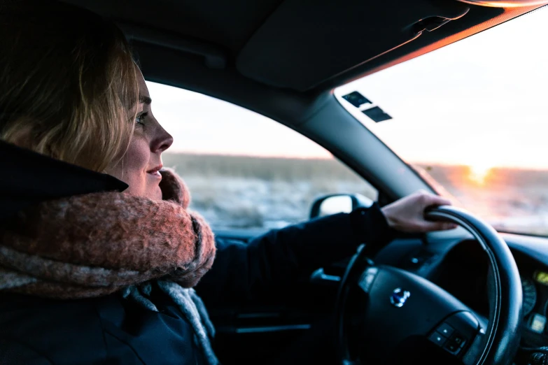 a person driving with a cowl over their head