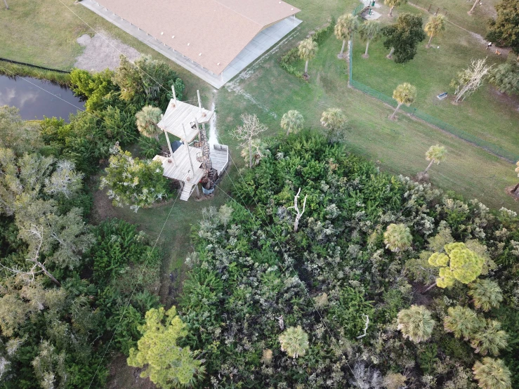 an aerial view of an old farmhouse and garden