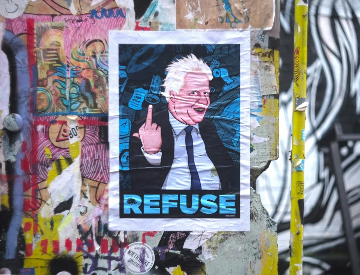 a graffiti wall that has a sign of bernie