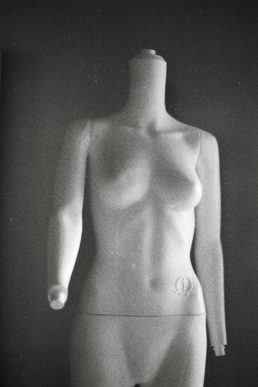 a white dummy is pographed against the dark background