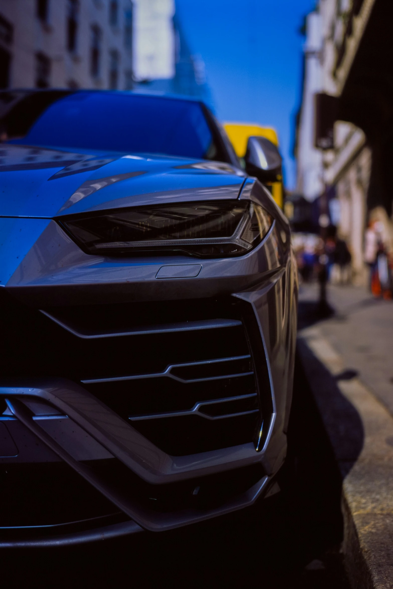 a blue lamb parked on the side of a street