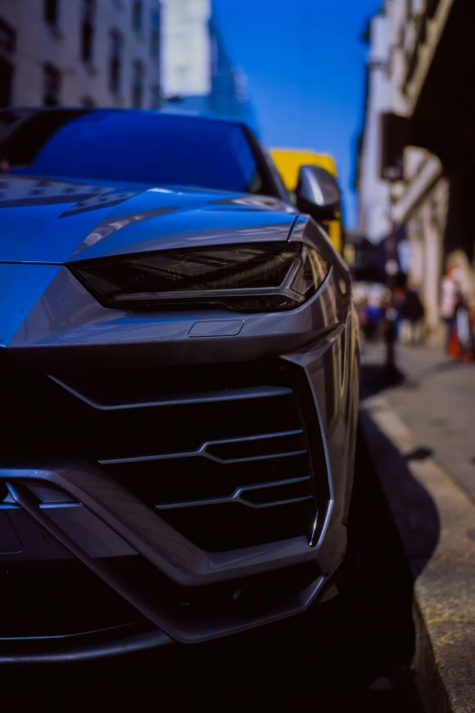 a blue lamb parked on the side of a street