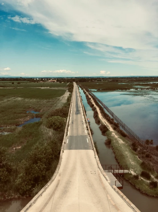 an aerial view of a highway with the water in front