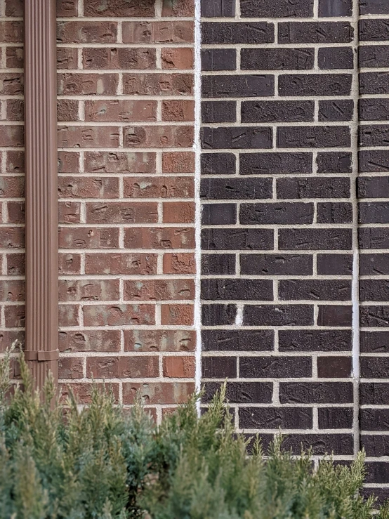 the side of an office building with a clock on it