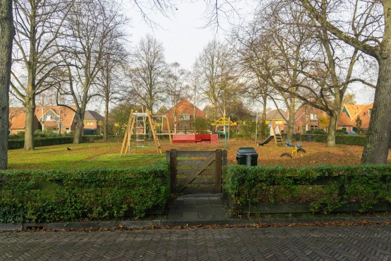 the child's playset is surrounded by grass