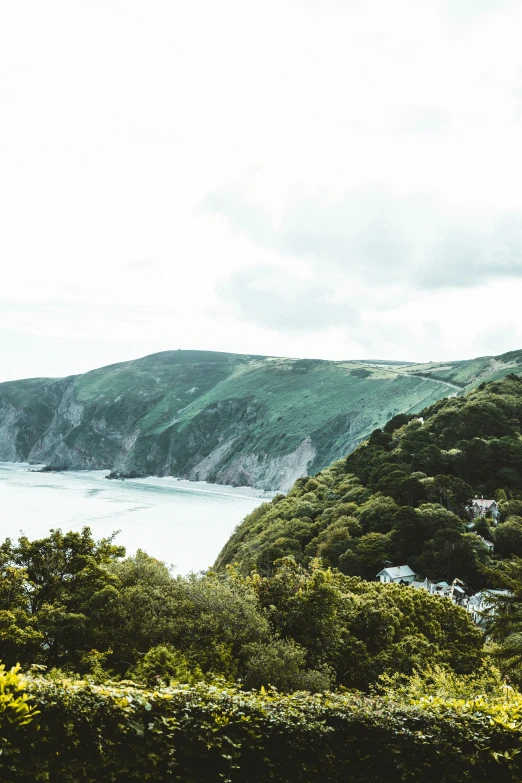 this view of the ocean shows a steep hillside