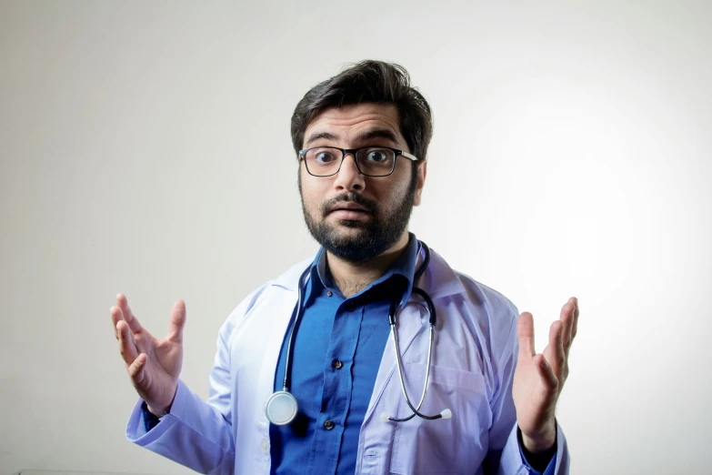 a man wearing glasses and a doctors coat