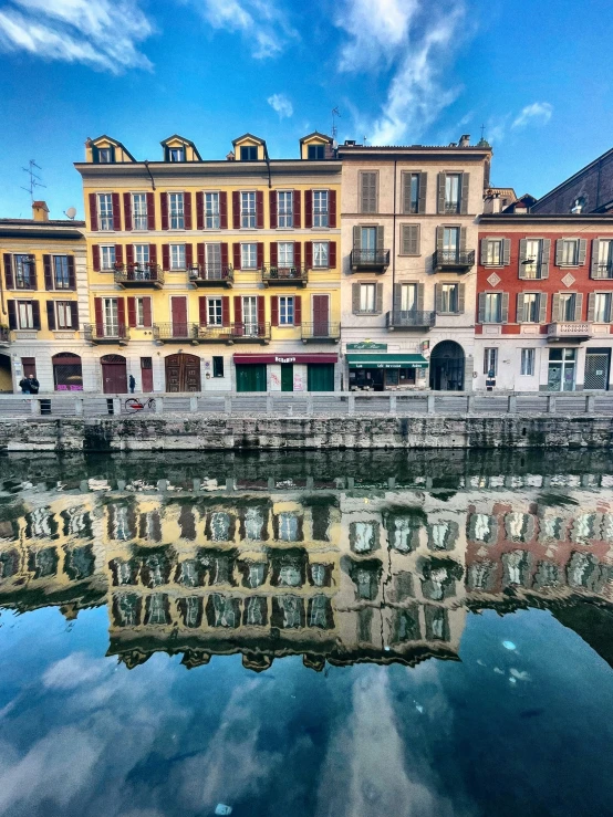 a lake that has several different buildings and is next to it