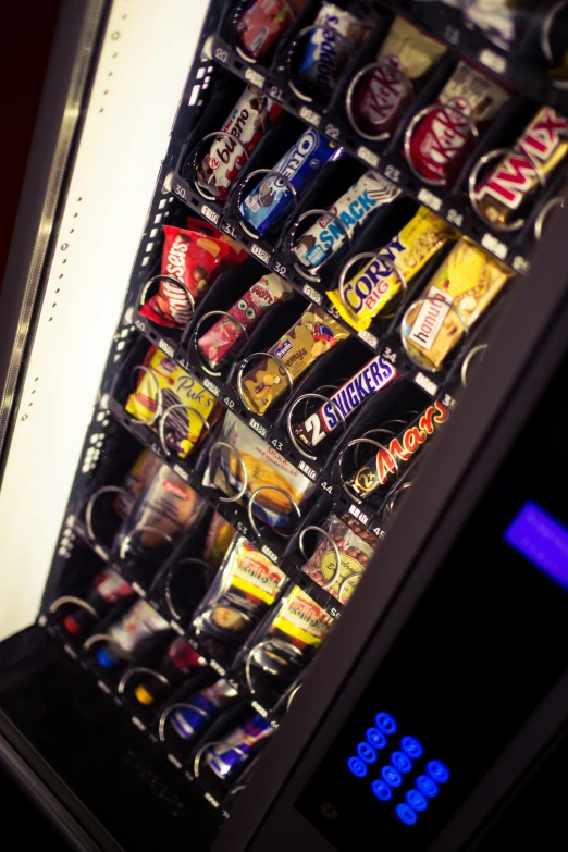 a vending machine has cans and drinks in it