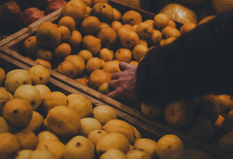 two boxes that are filled with different types of fruit