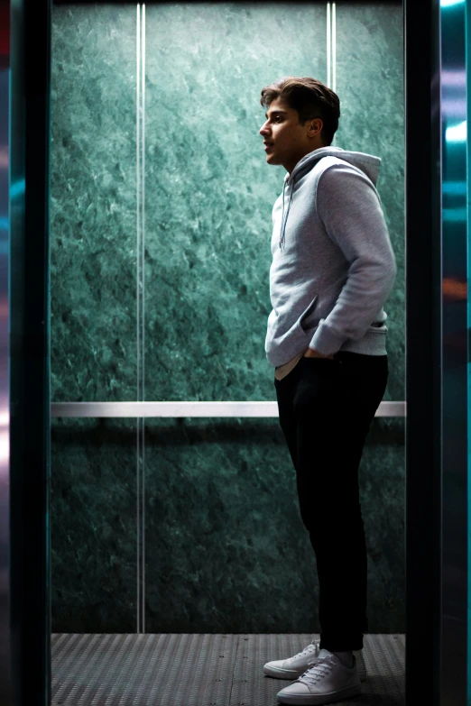 a man standing in front of a large glass door