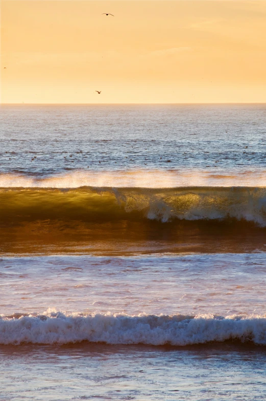 a person riding a surfboard on top of the water