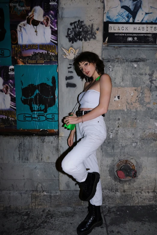 a woman posing in an urban alley side fashion