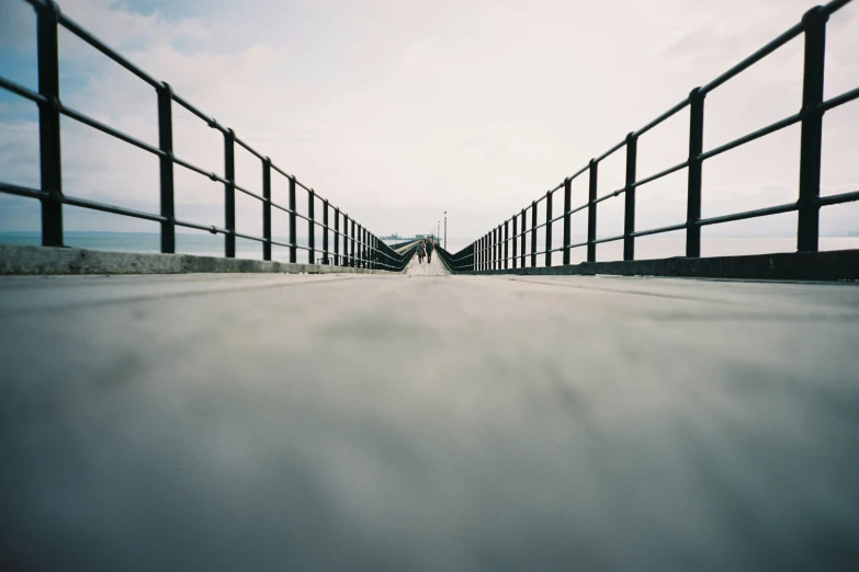 a person walking down an empty road with no one