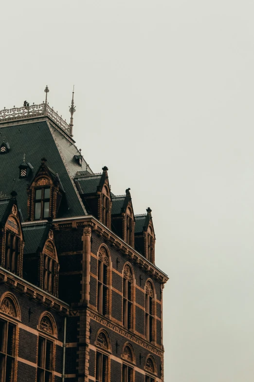 an old building is shown on a foggy day