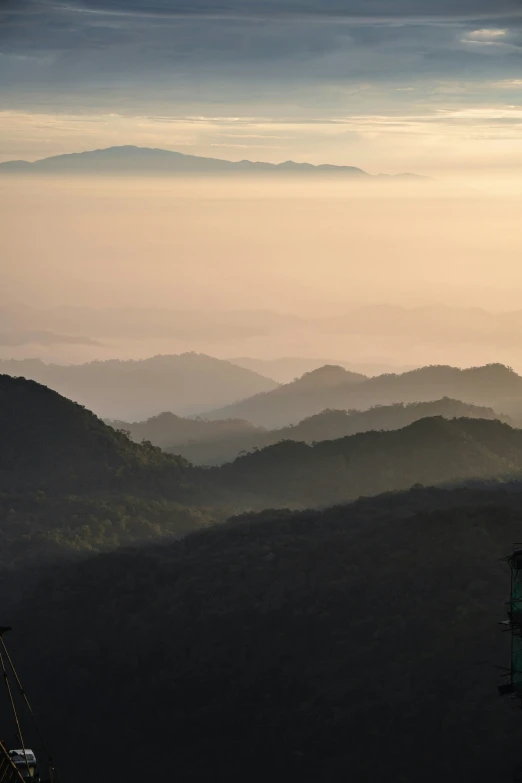 the mountains are all covered in thick mist