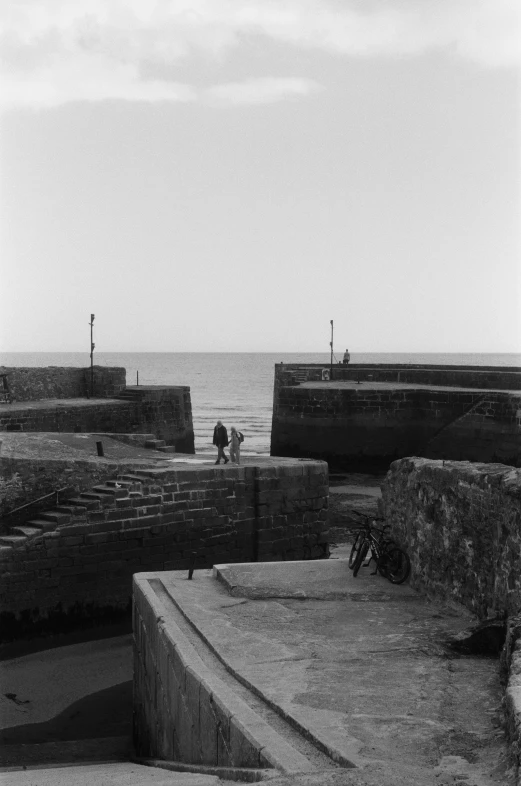 a person riding a skate board near the ocean