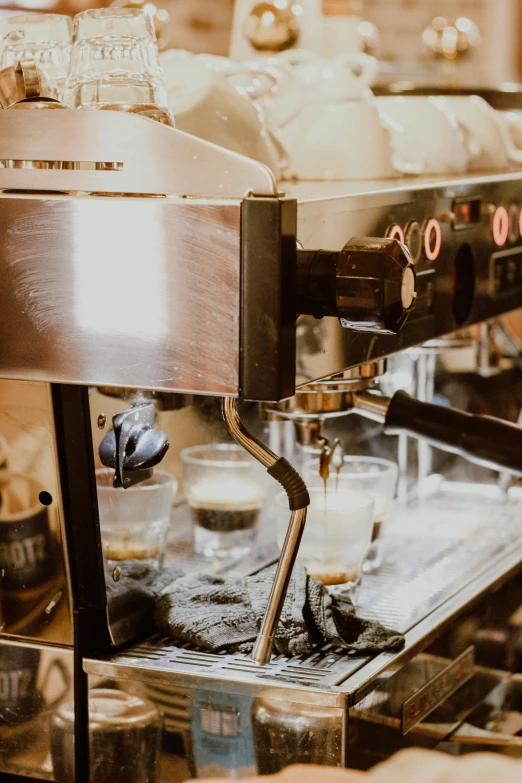 an espresso machine is running and boiling coffee
