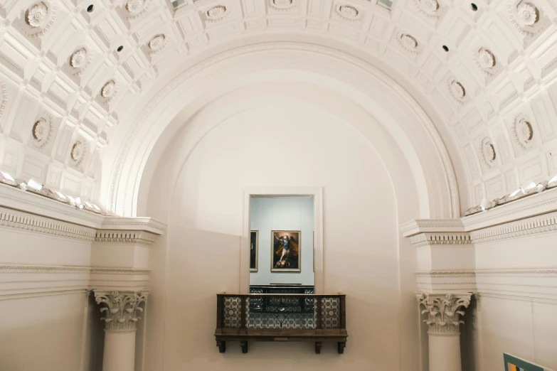 there is a wall hanging in the center of a large room