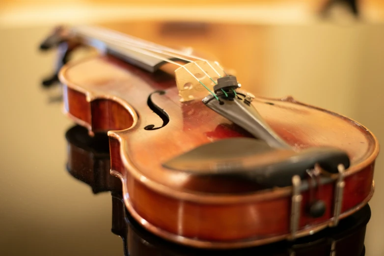 a violin on a table and some scissors