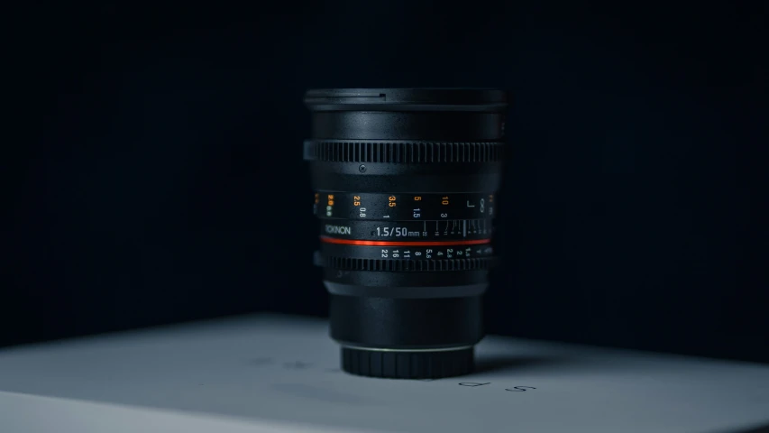 an ef lens is sitting on a white table