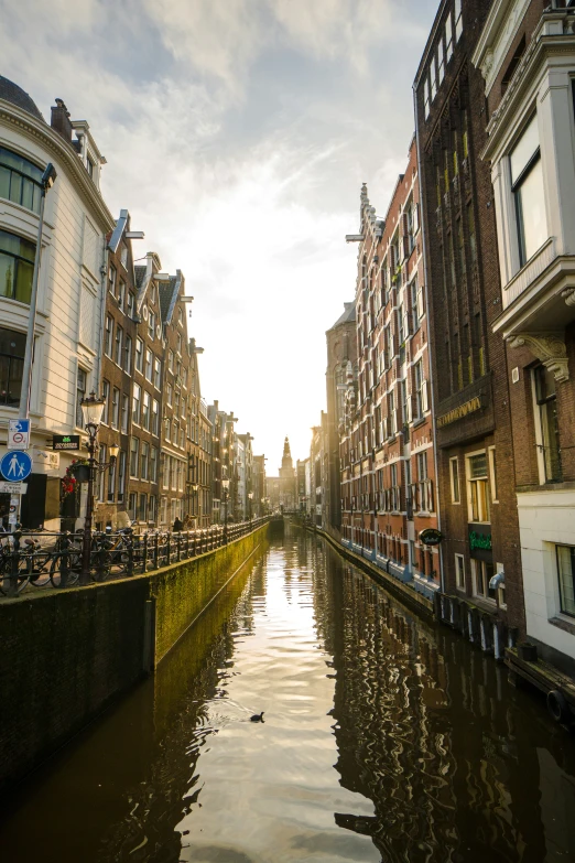 a canal is lined with buildings on both sides