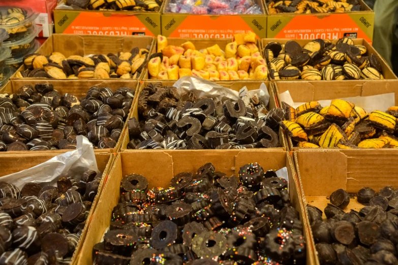 a group of boxes that are filled with different types of donuts