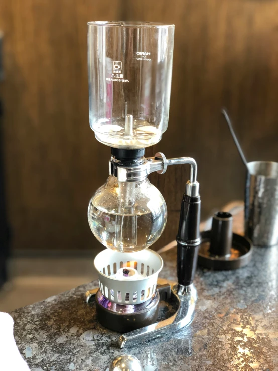 a cup that is sitting on top of a coffee maker