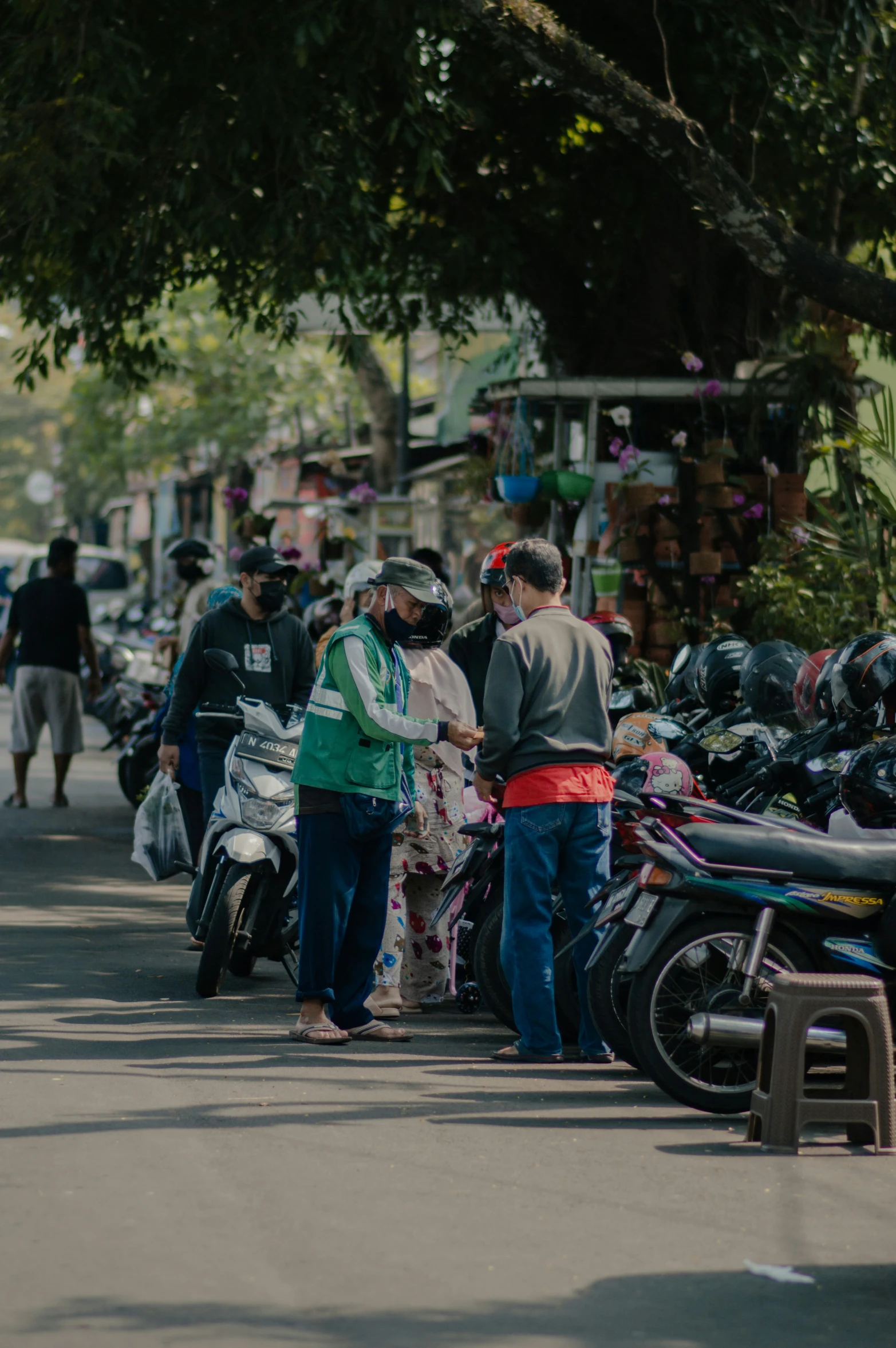 people line up in the street and buy motorcycles