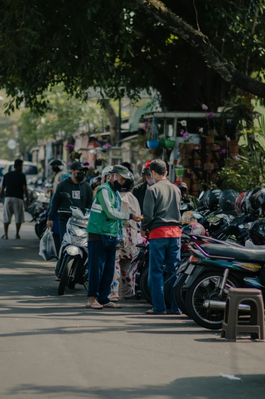 people line up in the street and buy motorcycles