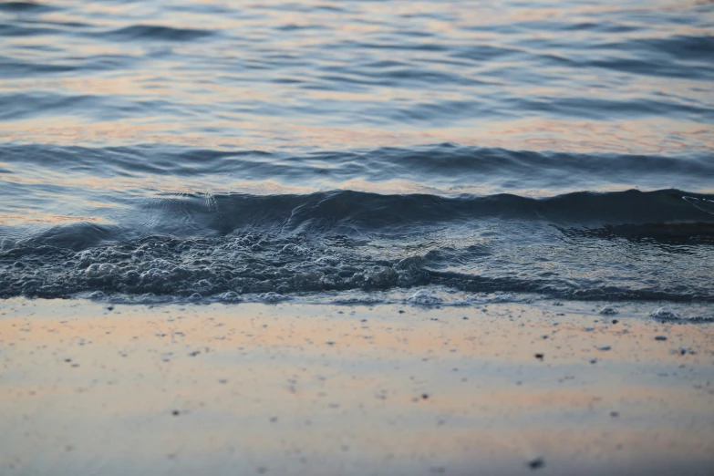 the view of an ocean with very little waves